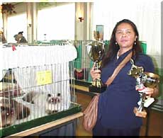 Narumon with three trophies